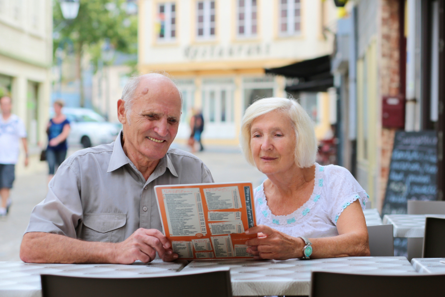 couple reading a menu