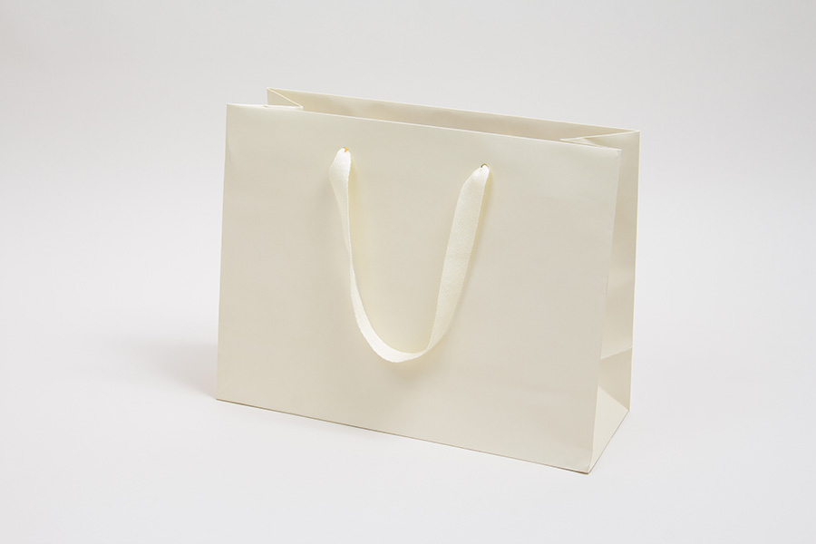 13 x 5 x 10 MATTE IVORY TINTED PAPER EUROTOTES - TWILL RIBBON HANDLES
