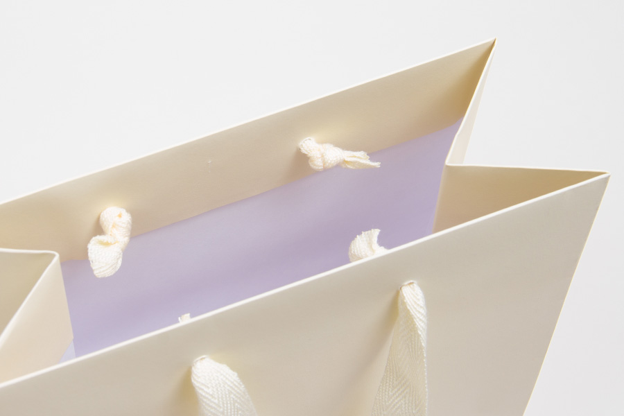 13 x 5 x 10 MATTE IVORY TINTED PAPER EUROTOTES - TWILL RIBBON HANDLES