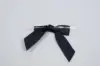 3" X 2-3/4" SATIN BLACK PRE-TIED BOW CLEAR TWIST TIE